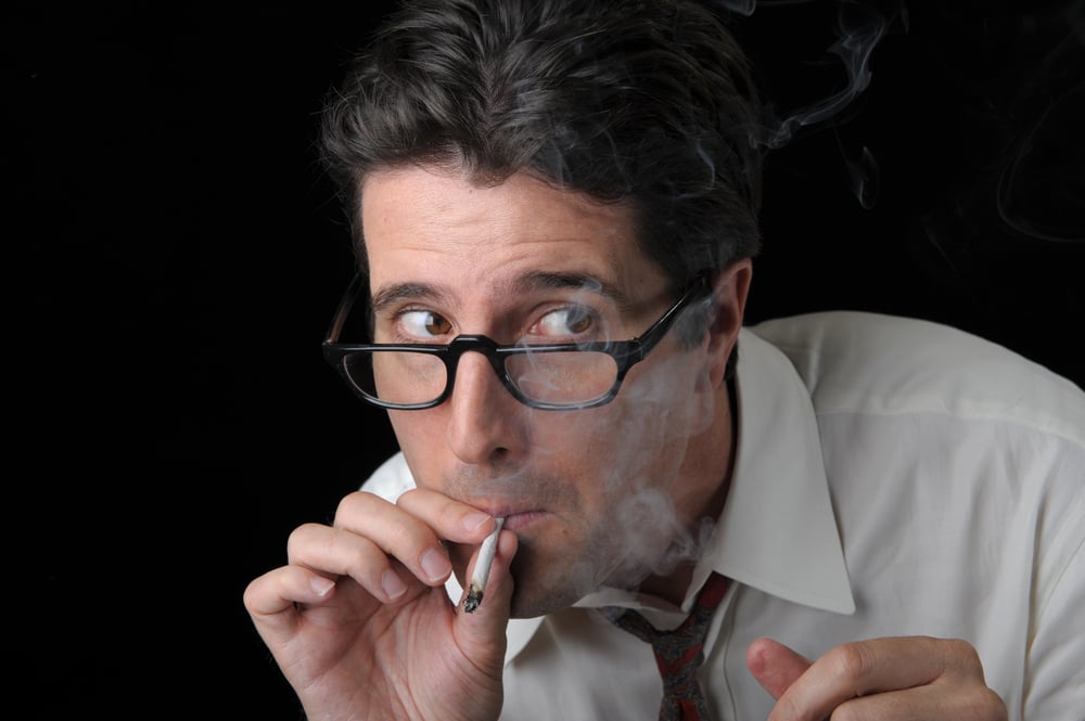 paranoid man smoking a joint