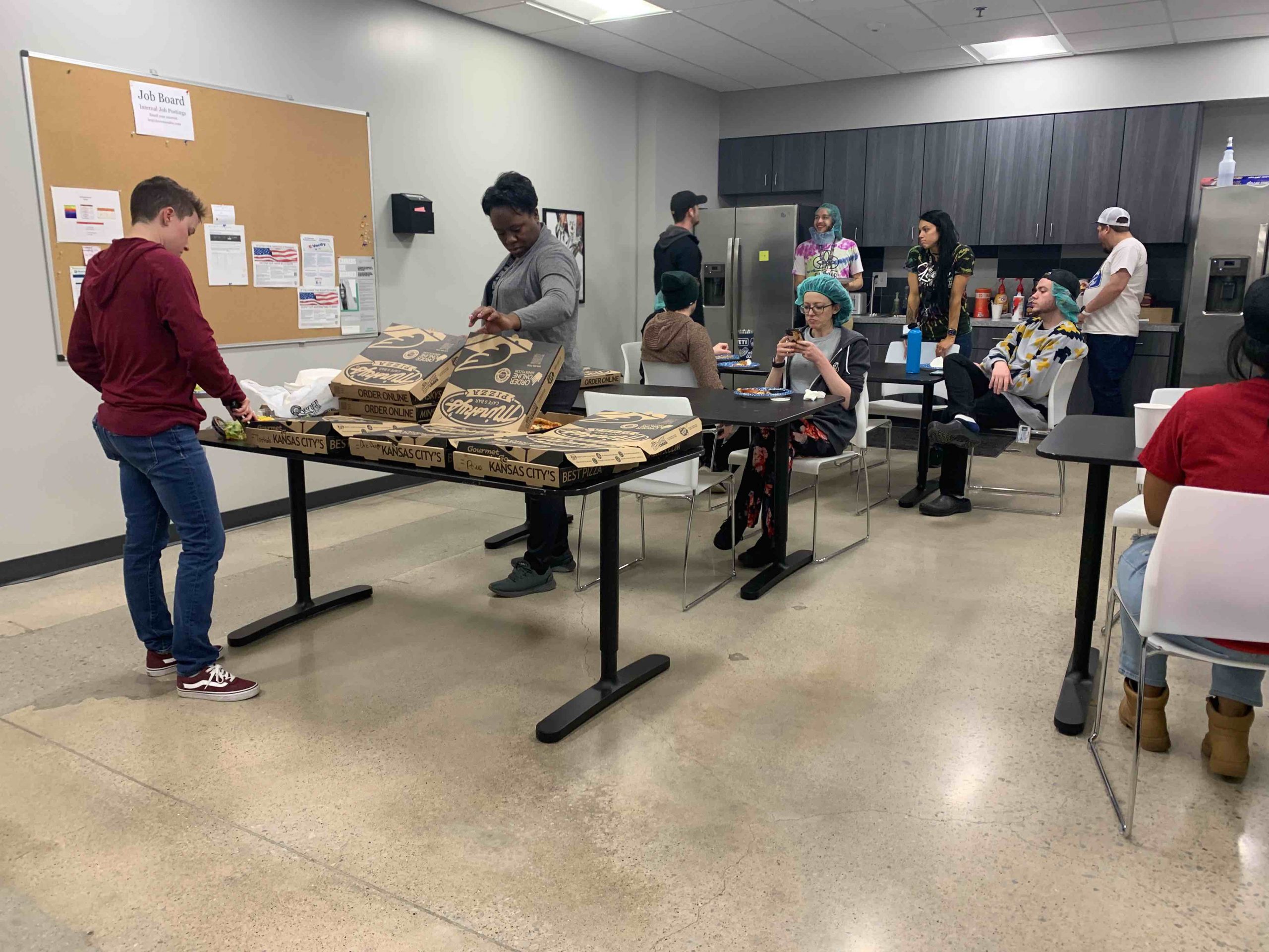 clovr employees taking a pizza break