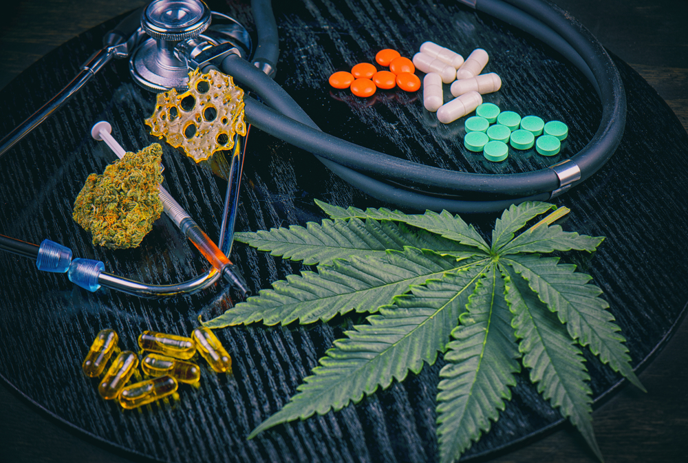 marijuana leaf with different marijuana concentrates and stethoscope 