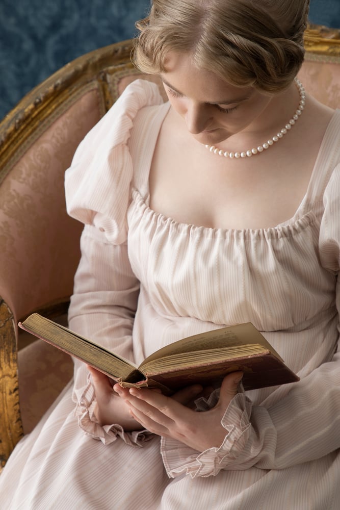 edwardian age woman reading a book