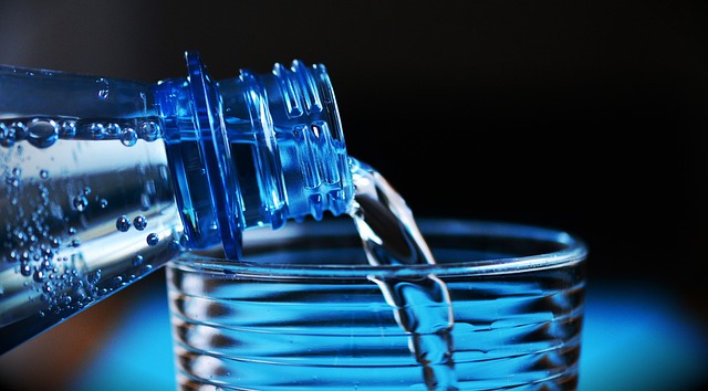 pouring water into a glass