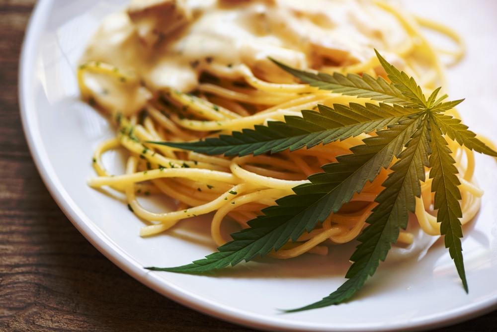plate of pasta and marijuana leaf