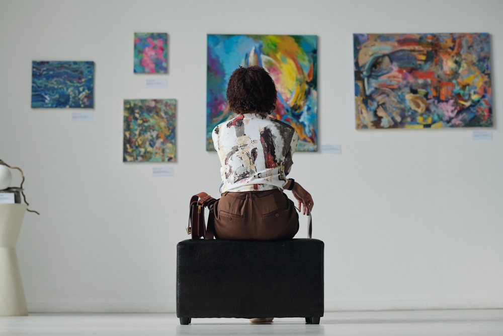 woman sitting in an art museum