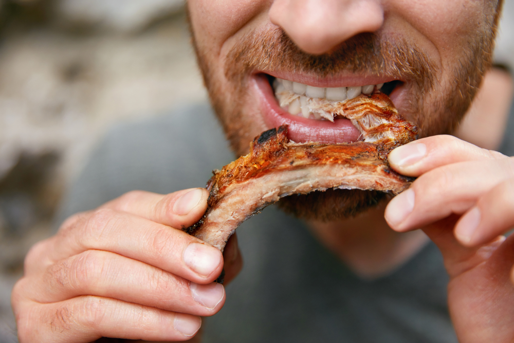 man eating pizza