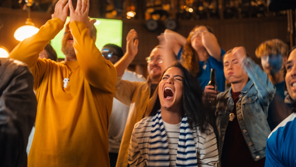 drunk people in a crowded bar